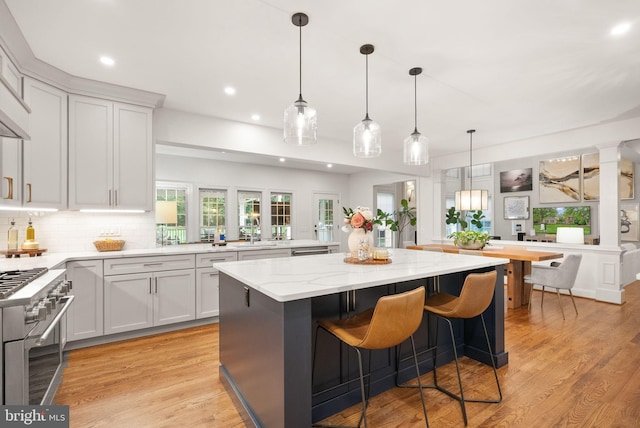12019 Wandabury Rd, Oakton, VA 22124 - kitchen featuring appliances with stainless steel finishes, a kitchen island, recessed lighting, a sink, and decorative backsplash