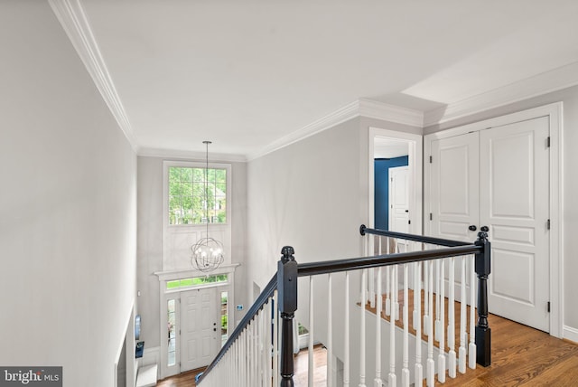 12019 Wandabury Rd, Oakton, VA 22124 - hall with an upstairs landing, a chandelier, ornamental molding, wood finished floors, and baseboards
