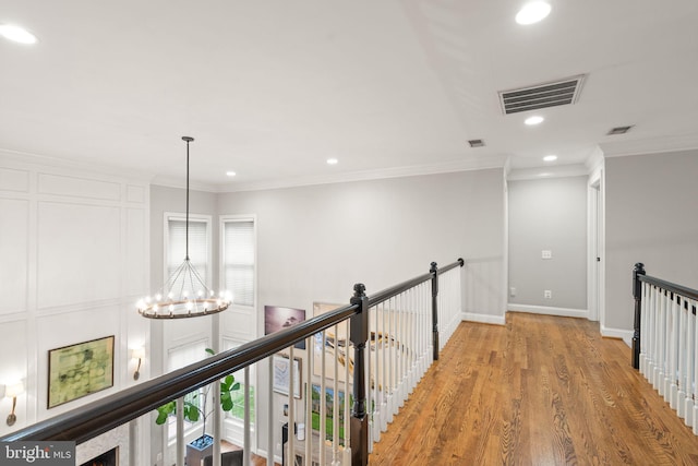 12019 Wandabury Rd, Oakton, VA 22124 - hall with a chandelier, an upstairs landing, ornamental molding, recessed lighting, and light wood-style floors