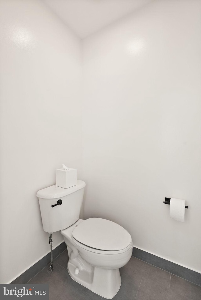 12019 Wandabury Rd, Oakton, VA 22124 - bathroom featuring tile patterned flooring, toilet, and baseboards