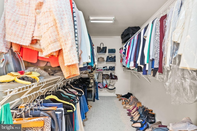 12019 Wandabury Rd, Oakton, VA 22124 - walk in closet featuring carpet flooring