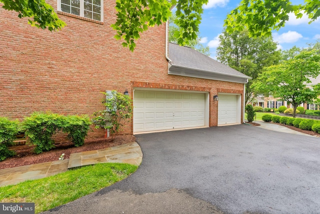 12019 Wandabury Rd, Oakton, VA 22124 - garage featuring driveway