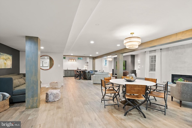 12019 Wandabury Rd, Oakton, VA 22124 - dining area featuring light wood-type flooring, a large fireplace, and recessed lighting