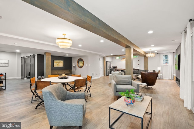 12019 Wandabury Rd, Oakton, VA 22124 - living area with a barn door, recessed lighting, baseboards, and light wood-type flooring
