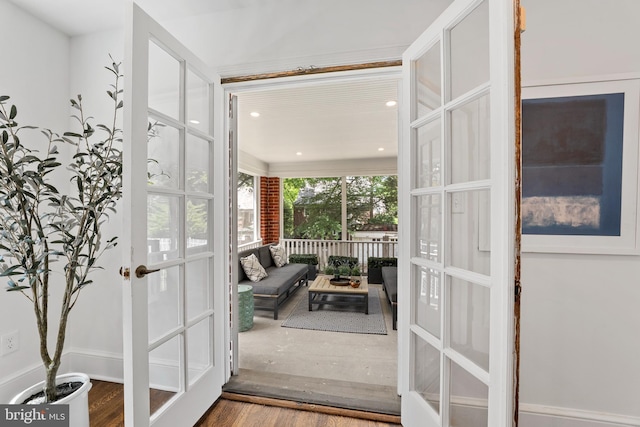 entryway with french doors, recessed lighting, and wood finished floors