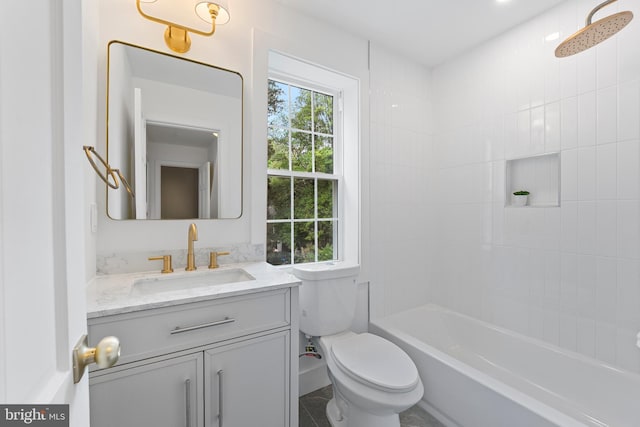 bathroom with toilet, shower / tub combination, and vanity