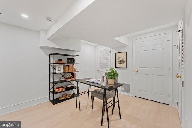 home office with recessed lighting, baseboards, visible vents, and light wood-type flooring
