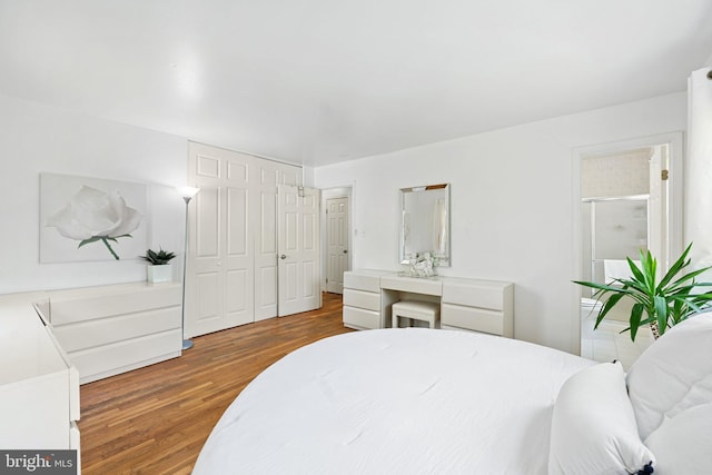 bedroom featuring a closet and wood finished floors