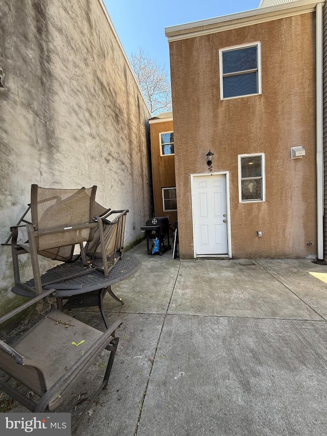 653 N 37th St, Philadelphia, PA 19104 - back of property featuring a patio and stucco siding