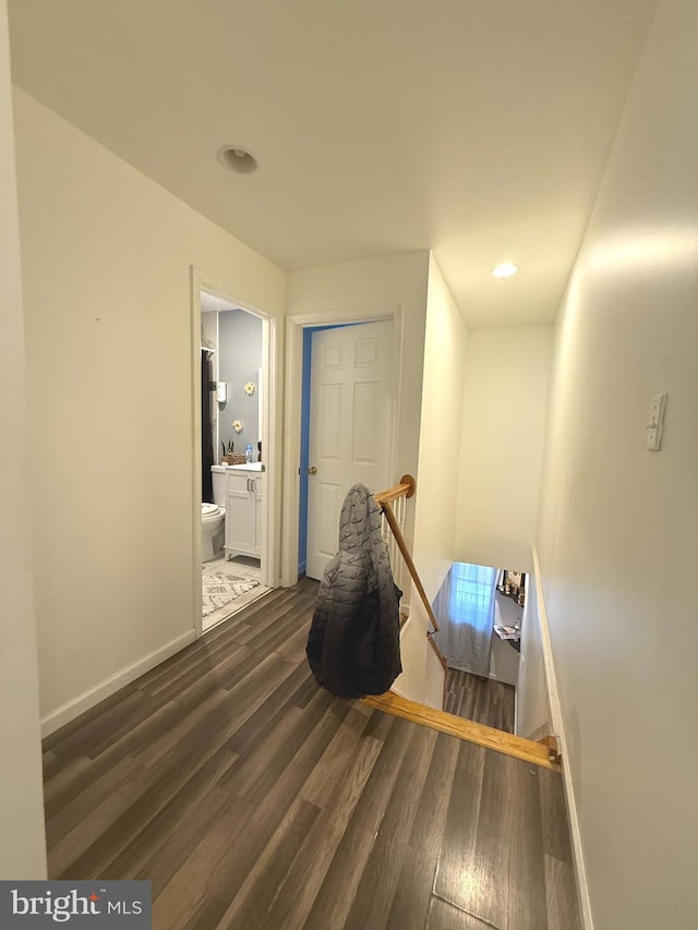 653 N 37th St, Philadelphia, PA 19104 - hall featuring a sink, baseboards, an upstairs landing, and dark wood finished floors
