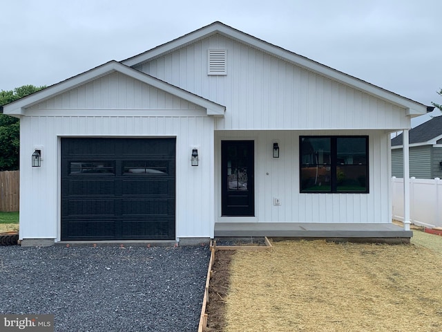 274 Royal Ave, Strasburg, VA 22657 - view of front of house with a porch, a garage, and gravel driveway