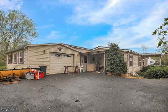 view of front of home with an attached garage and driveway