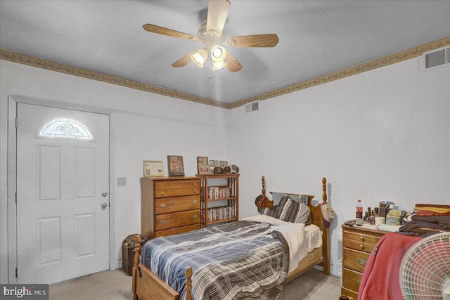 carpeted bedroom featuring visible vents and ceiling fan