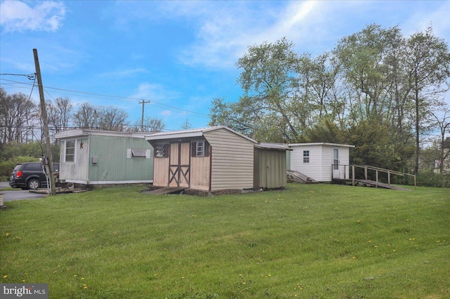 view of shed with an AC wall unit