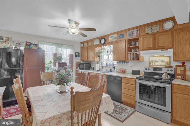 kitchen with a ceiling fan, under cabinet range hood, black appliances, and a wealth of natural light