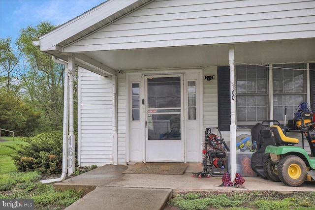 doorway to property featuring covered porch
