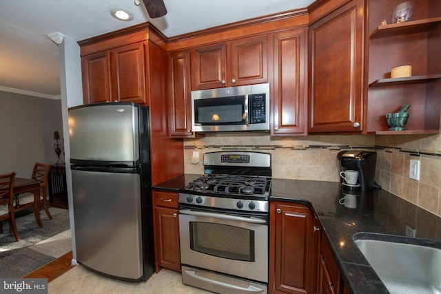 kitchen with open shelves, decorative backsplash, appliances with stainless steel finishes, and dark stone countertops