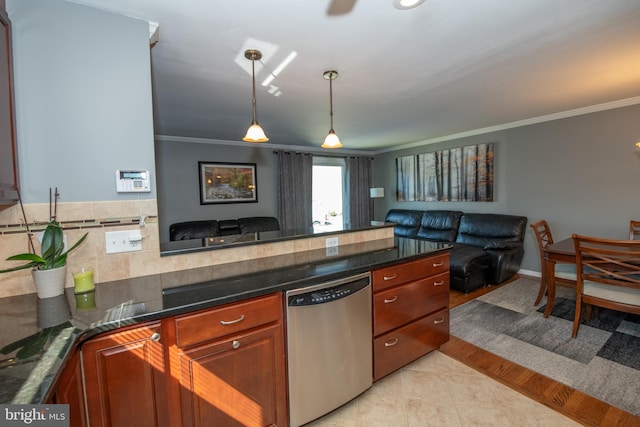 kitchen featuring crown molding, hanging light fixtures, stainless steel dishwasher, light tile patterned floors, and open floor plan