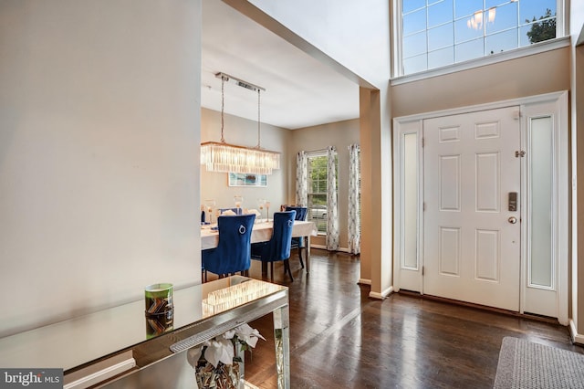 9506 Wilton Pl, Clinton, MD 20735 - foyer with dark wood-type flooring, baseboards, and a towering ceiling