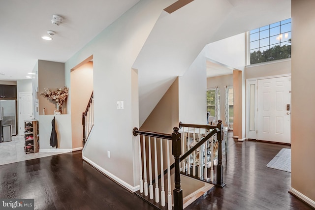 9506 Wilton Pl, Clinton, MD 20735 - hall featuring wood finished floors, baseboards, and stairway