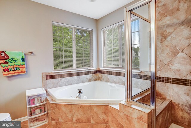 9506 Wilton Pl, Clinton, MD 20735 - full bathroom with a whirlpool tub, a tile shower, and toilet