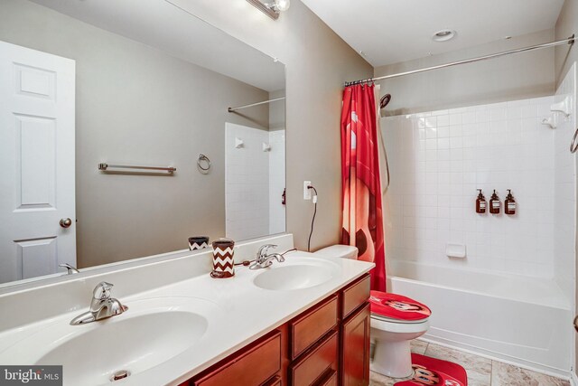 9506 Wilton Pl, Clinton, MD 20735 - full bath with toilet, shower / bath combo with shower curtain, and double vanity
