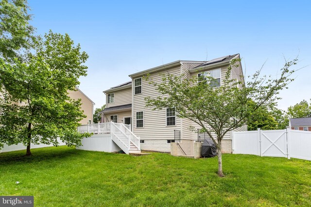 9506 Wilton Pl, Clinton, MD 20735 - rear view of property featuring stairway, a wooden deck, crawl space, and a gate
