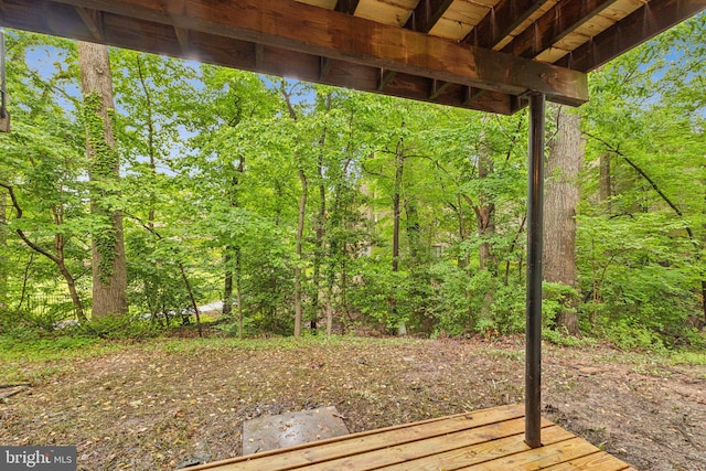 deck featuring a wooded view