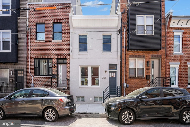 view of property with brick siding