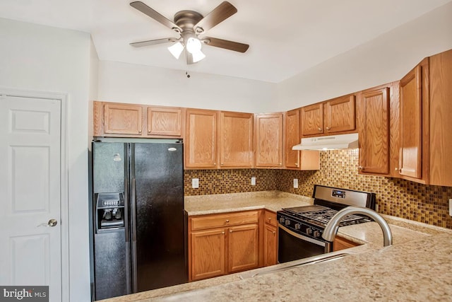 13301 New Acadia Ln Unit 207, Upper Marlboro, MD 20774 - kitchen featuring black fridge, stainless steel range with gas stovetop, under cabinet range hood, light countertops, and a ceiling fan