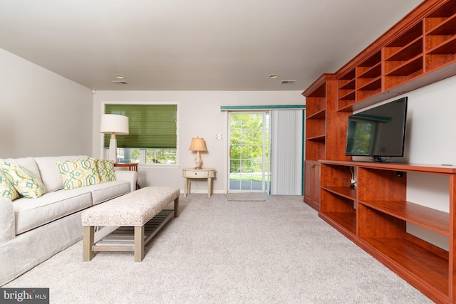 living room featuring carpet floors and visible vents