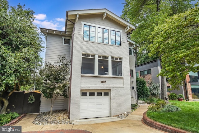 3207 19th St N, Arlington, VA 22201 - view of front of home featuring a garage, brick siding, and driveway