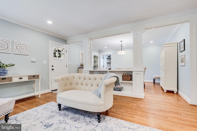 3207 19th St N, Arlington, VA 22201 - living room featuring ornate columns, light wood-style floors, ornamental molding, recessed lighting, and baseboards