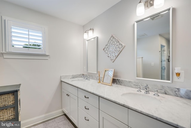 3207 19th St N, Arlington, VA 22201 - bathroom featuring double vanity, a stall shower, and baseboards