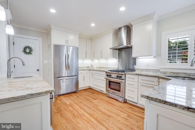 3207 19th St N, Arlington, VA 22201 - kitchen featuring appliances with stainless steel finishes, wall chimney exhaust hood, a sink, crown molding, and white cabinets