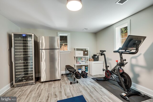 3207 19th St N, Arlington, VA 22201 - exercise area featuring beverage cooler, baseboards, and wood finished floors