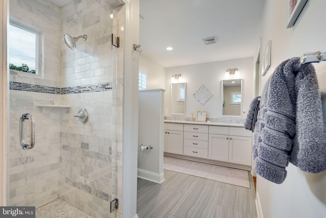 3207 19th St N, Arlington, VA 22201 - bathroom featuring plenty of natural light, a shower stall, double vanity, and recessed lighting