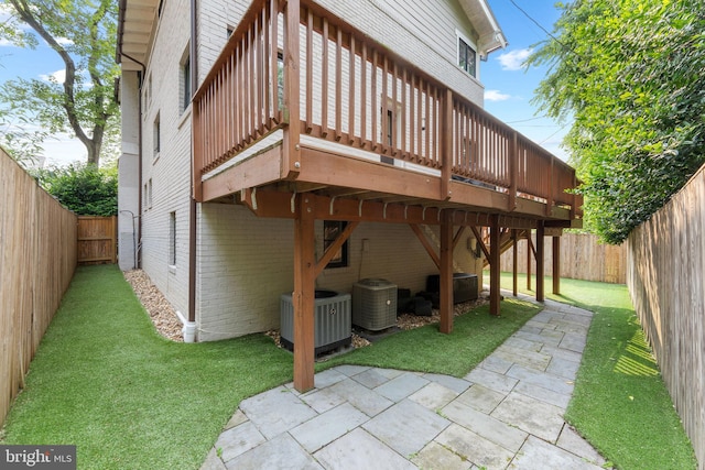 3207 19th St N, Arlington, VA 22201 - rear view of house with brick siding, cooling unit, a patio, and a wooden deck