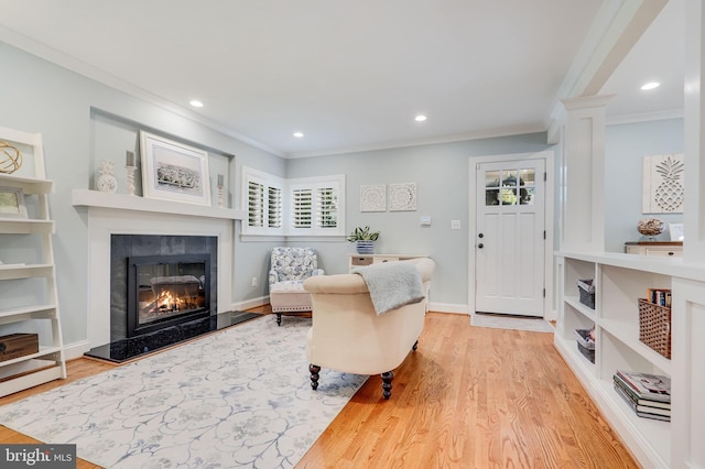 3207 19th St N, Arlington, VA 22201 - living area featuring ornamental molding, wood finished floors, a tiled fireplace, recessed lighting, and ornate columns