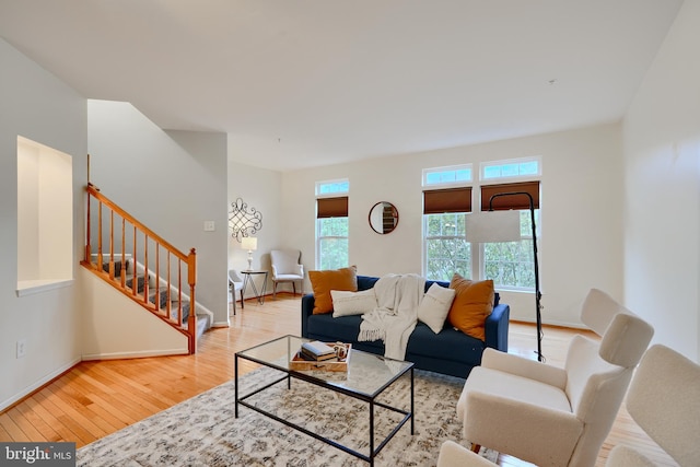 5012 Strawbridge Ter, Perry Hall, MD 21128 - living room featuring stairs, hardwood / wood-style flooring, and baseboards