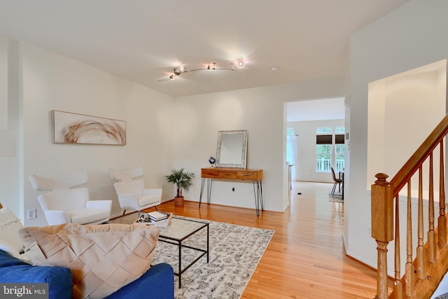 5012 Strawbridge Ter, Perry Hall, MD 21128 - living area featuring stairway and light wood-style floors