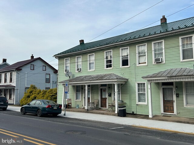 63 S 4th St, Newport, PA 17074 - view of front of house with a chimney and metal roof