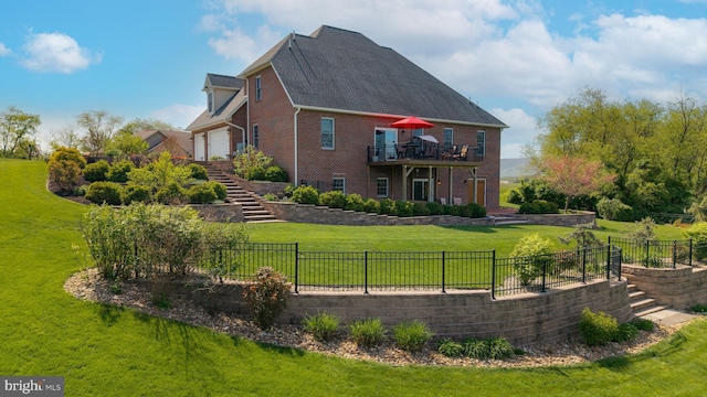 239 Abishire Way, Chambersburg, PA 17202 - back of property featuring a fenced backyard, a lawn, stairway, and brick siding