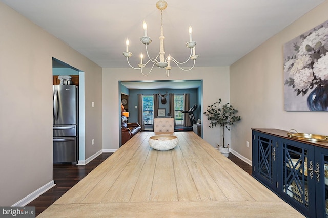 278 Otter Way, Frederica, DE 19946 - dining space with baseboards, an inviting chandelier, and dark wood-style floors