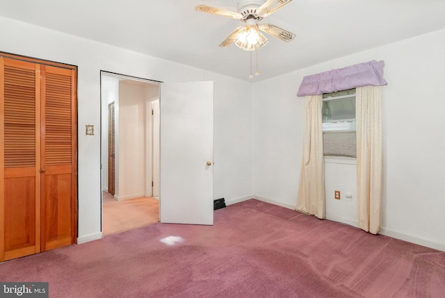 unfurnished bedroom featuring carpet floors, baseboards, and a ceiling fan