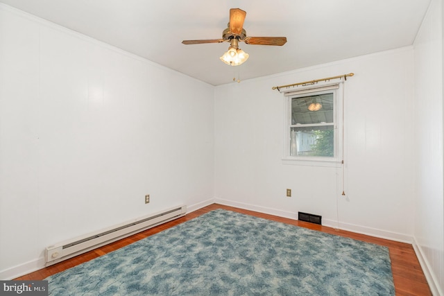 empty room with visible vents, a baseboard radiator, a ceiling fan, and wood finished floors