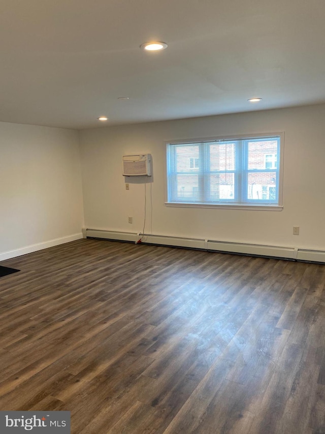 1148 Tabor Plz, Philadelphia, PA 19111 - unfurnished room featuring an AC wall unit, dark wood finished floors, recessed lighting, baseboards, and a baseboard radiator
