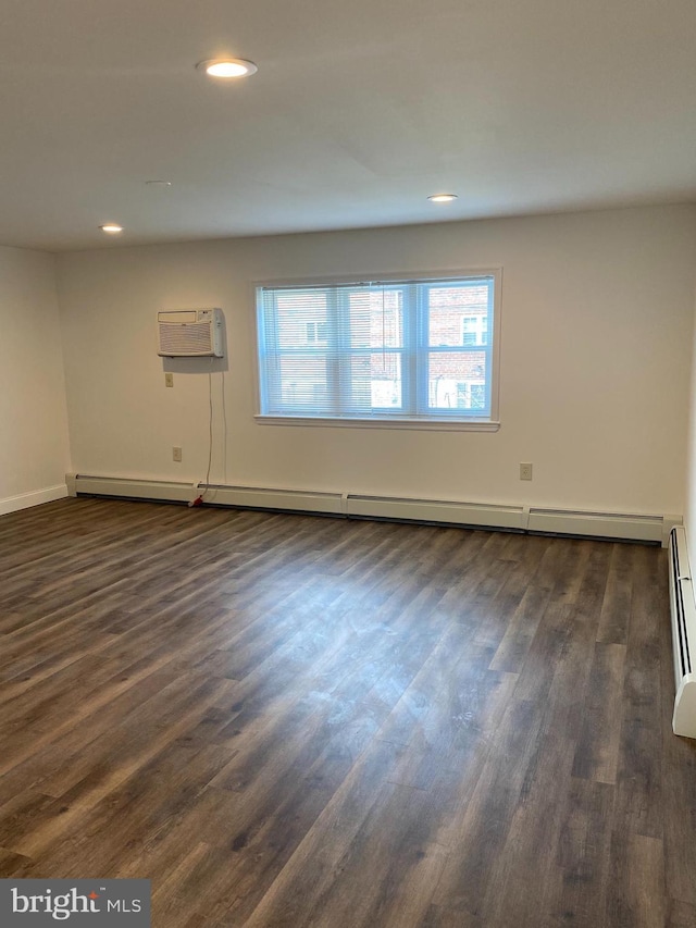 1148 Tabor Plz, Philadelphia, PA 19111 - empty room with baseboards, baseboard heating, recessed lighting, a wall mounted AC, and dark wood finished floors