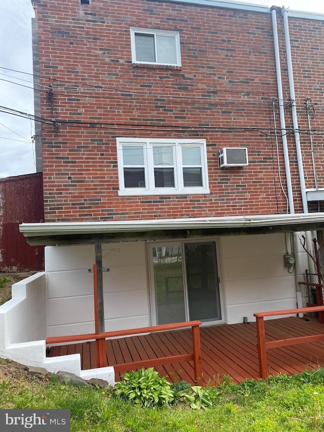 1148 Tabor Plz, Philadelphia, PA 19111 - rear view of property with brick siding and an AC wall unit
