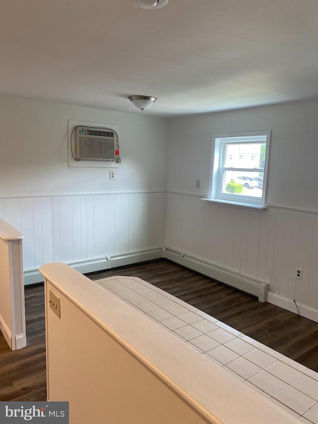 1148 Tabor Plz, Philadelphia, PA 19111 - spare room with a baseboard radiator, dark wood-style flooring, a wall mounted AC, and wainscoting